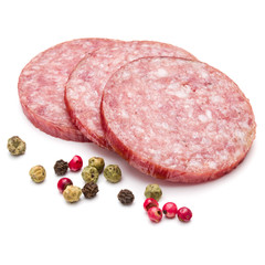 Salami smoked sausage three slices and peppercorns isolated on w