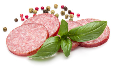 Salami smoked sausage slices, basil leaves and peppercorns isola