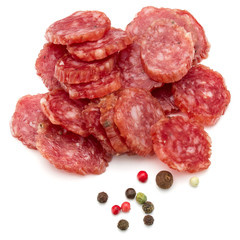 Salami smoked sausage slices and peppercorns isolated on white b