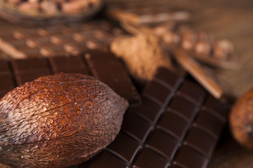 Chocolate bar, candy sweet, dessert food on wooden background