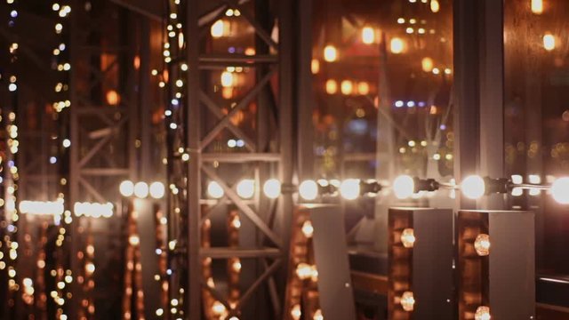 Electric garland decorating evening restaurant, Christmas mood and relaxation