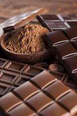 Chocolate bar, candy sweet, dessert food on wooden background