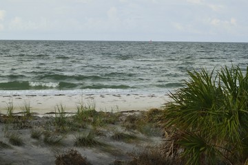 Waves rolling in to the beach at sunrise.