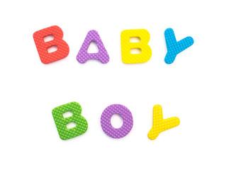 word of baby boy shaped by alphabet puzzles on white