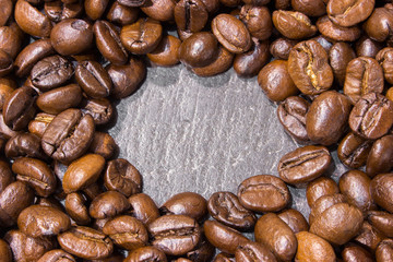 Coffee beans on black stone table