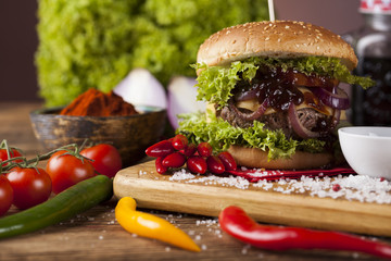 Close-up of home made burgers, wooden desk background