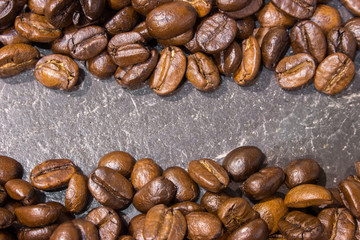 Coffee beans on black stone table