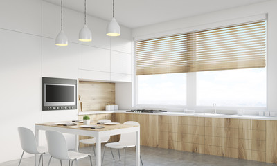 Corner view of kitchen table and TV set