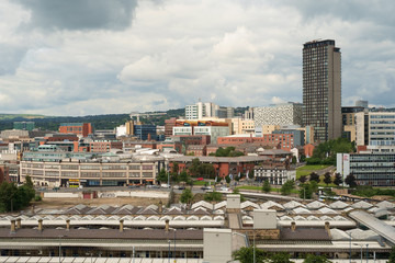 Cityscape of Sheffield with train station in foreground