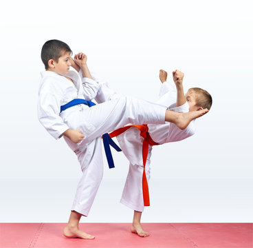 Karate children are beating kicks
