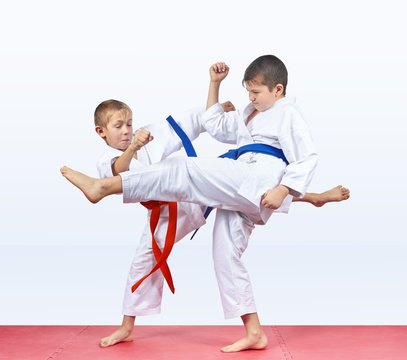 Karateka children beat kick leg