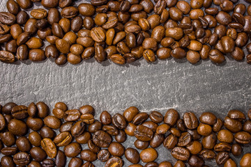 Coffee beans on black stone table