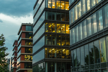 Obraz premium Perfect modern office buildings at dusk. Working time.