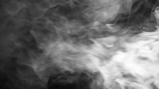 An isolated studio shot of white smoke over black background. This is ideal for vertically mounted monitors or screens.