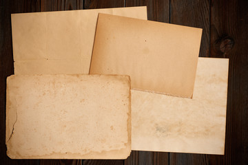Vintage paper on textured old wooden background