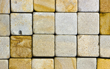 texture of yellow sandstone bricks close-up,