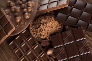 Chocolate bar, candy sweet, dessert food on wooden background