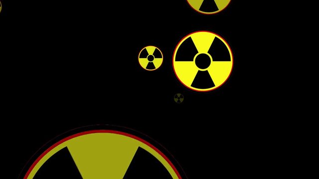 Radioactive danger sign. Many of the radiation warning signs are flying at the viewer, animation loop.