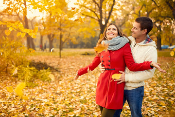 Fototapeta premium Love couple in autumn walking in park