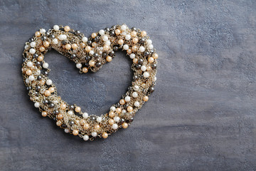 Golden necklace on a grey table