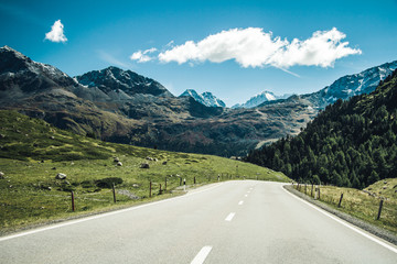 Fototapeta premium A road through swiss Alps.