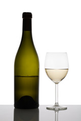 White wine glass and bottle of wine