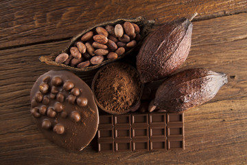 Chocolate bar, candy sweet, dessert food on wooden background