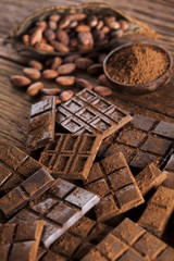 Dark and milk chocolate bar on a wooden table