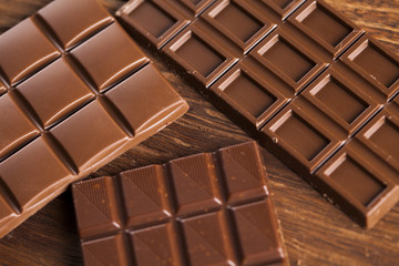 Bars Chocolate , candy sweet, dessert food on wooden background