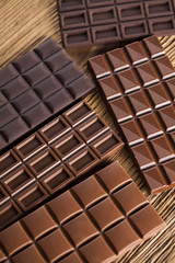 Bars Chocolate , candy sweet, dessert food on wooden background
