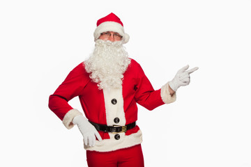 Santa Claus pointing sign with smile, isolated on white backgrou