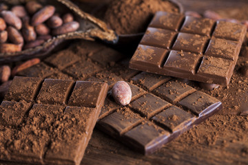 Dark and milk chocolate bar on a wooden table