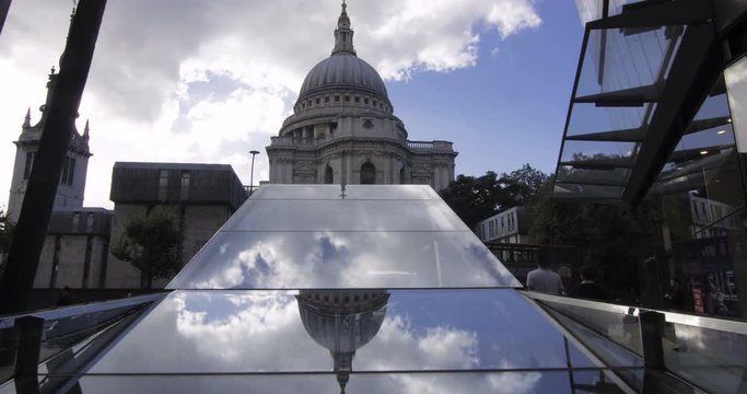Time lapse view of St Paul cathedral in London with clouds reflected in a mirror