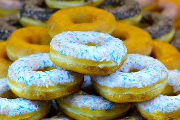 Donuts with frosting in the foreground