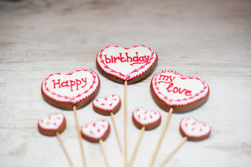 Fototapeta premium Funny and colorful gingerbread shapes on sticks.Happy Birthday