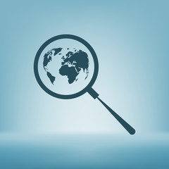 Analyzing the world. Magnifier glass with globe