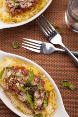 Freshly roasted spaghetti squash topped with homemade organic bolognese sauce