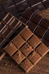 Bars Chocolate , candy sweet, dessert food on wooden background