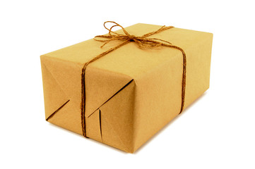 One single small mail package parcel wrapped brown paper tied with string isolated on white background photo
