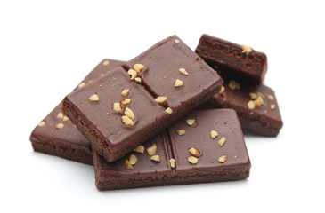 Chocolate Brownies with Nuts on Top on a White Background