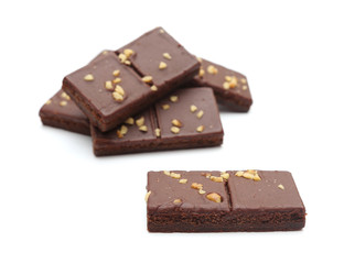 Chocolate Brownies with Nuts on Top on a White Background