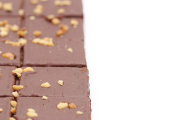 Chocolate Brownies with Nuts on Top on a White Background