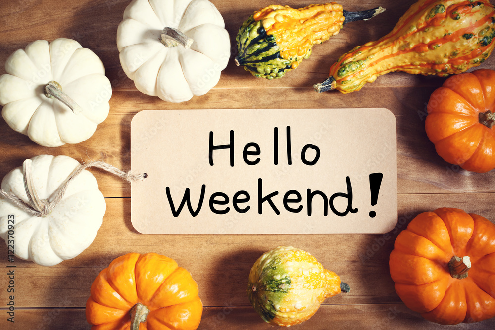 Wall mural hello weekend message with colorful pumpkins