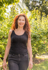 Fototapeta premium woman in apple orchard