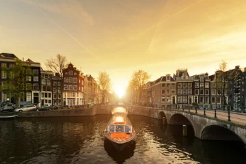 Tuinposter Amsterdam canal cruise ship with Netherlands traditional house  © ake1150