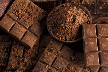 Dark and milk chocolate bar on a wooden table