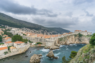 Fototapeta na wymiar The view of the medieval Dubrovnik's city walls from Fort Lovrijenac, in Croatia.