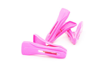 plastic clothespins on white background