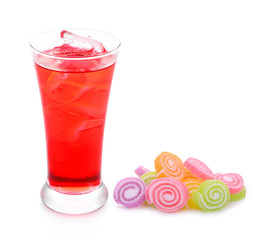 red sparkling water with ice in a glass and jelly sweet isolated