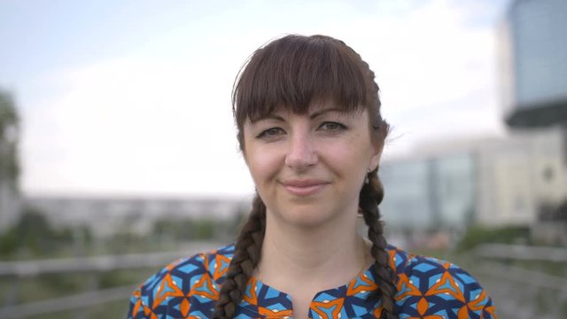 Portrait of a Woman Looking at the Camera and Smiling Slow Motion